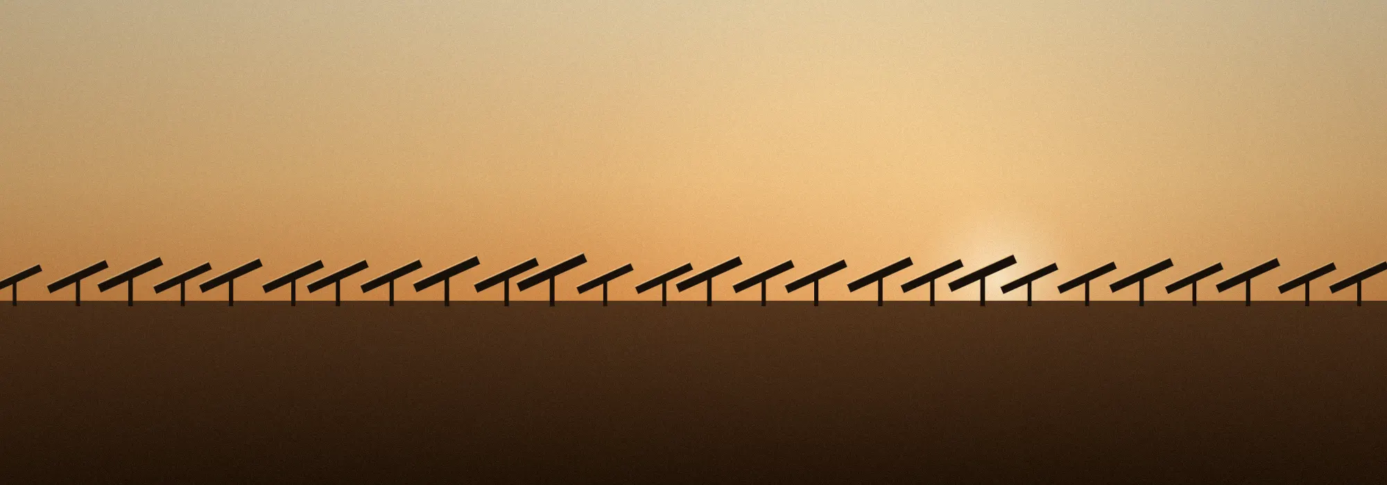 Silhouetted row of solar trackers against a dusk sky